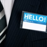 Namebadge saying hello on a well dressed businessman - insert your own information