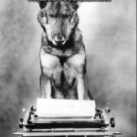 a dog in front of a typewriter